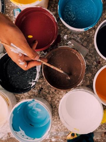 Photo of paint and brushes by Kelli Tungay