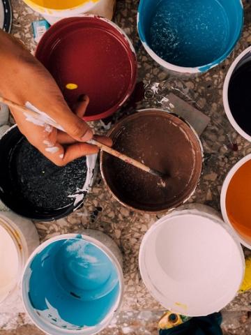 Photo of paint and brushes by Kelli Tungay